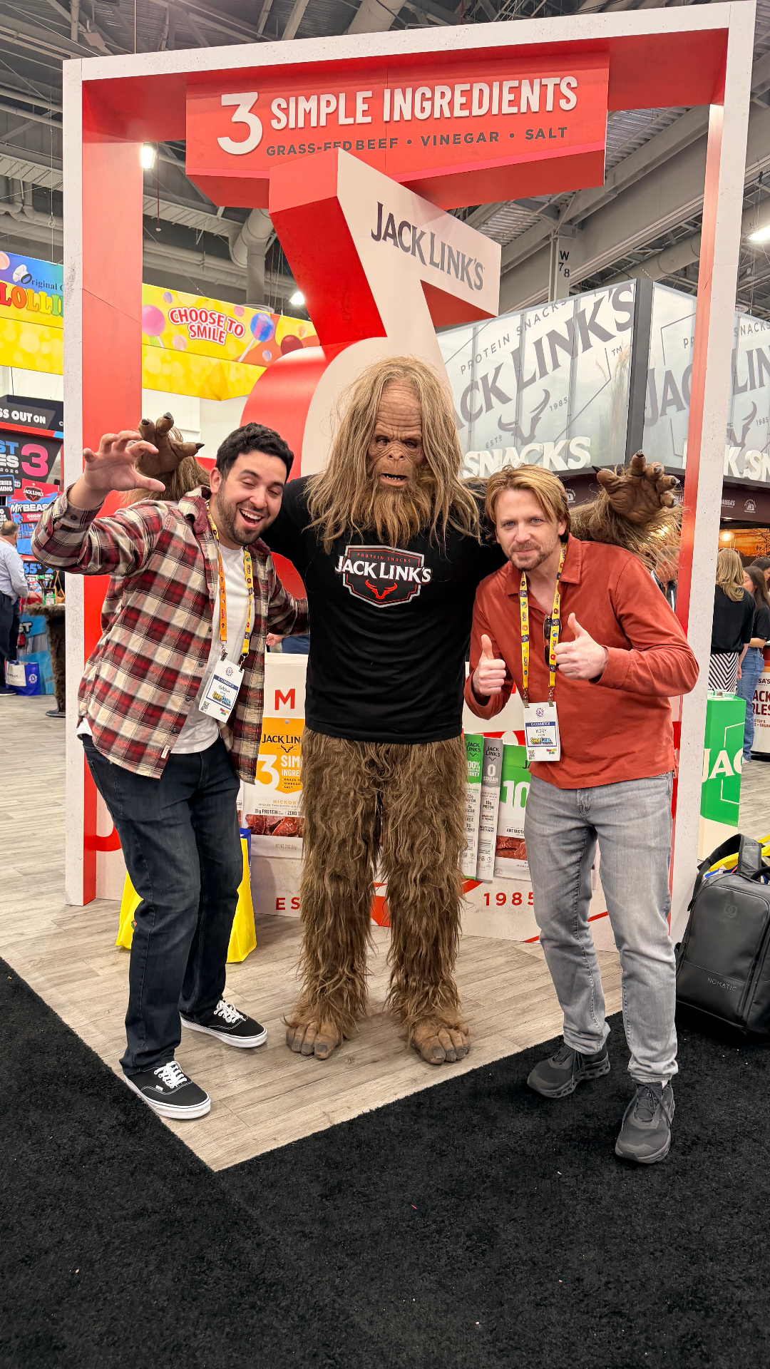 Shop Club founders posing with Sasquatch at the Jack Link's booth